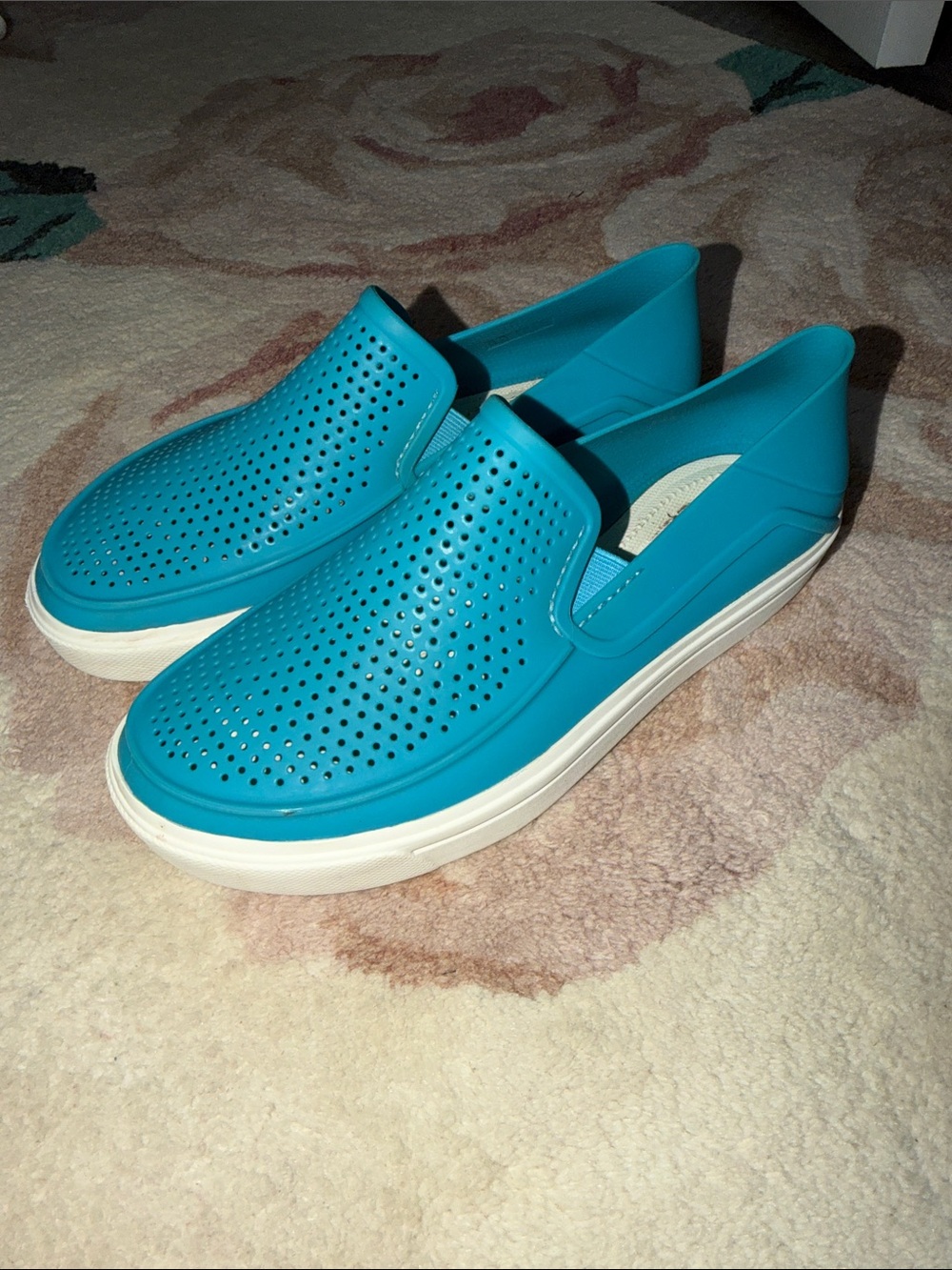 CROCS Women’s Slip-On Perforated Sneakers in Teal and White